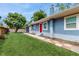 Charming single-story home with a bright red door and freshly cut lawn at 1202 E Caracas St, Tampa, FL 33603