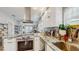Bright, modern kitchen with granite countertops, stainless appliances, and open layout flowing into the living area at 1202 E Caracas St, Tampa, FL 33603