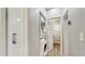 Hall view of in-unit laundry with stacked washer and dryer, plus closet at 1202 E Caracas St, Tampa, FL 33603