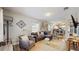Inviting living room with hardwood floors, a comfortable sofa, and stylish decor in an open floor plan at 1202 E Caracas St, Tampa, FL 33603