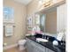 Elegant bathroom featuring a dark countertop, a sink, and a mirror at 14817 Tudor Chase Dr, Tampa, FL 33626