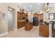 Spacious kitchen with dark wood cabinets, an island, and modern appliances for a functional cooking space at 14817 Tudor Chase Dr, Tampa, FL 33626