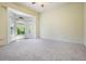 Spacious bedroom with neutral carpet, large windows with a bay window area, and lots of light at 15810 Stanton Ln, Tampa, FL 33647
