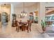 Cozy dining area with a chandelier and views of the lanai at 15810 Stanton Ln, Tampa, FL 33647