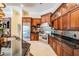 Beautiful kitchen with custom wood cabinets, stainless steel appliances, and granite counters at 15810 Stanton Ln, Tampa, FL 33647