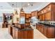 Gourmet kitchen features stainless steel appliances, a large island, and custom cabinetry at 15810 Stanton Ln, Tampa, FL 33647