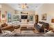 Bright living room with a view of the lake, built-in cabinets, and comfortable furniture at 15810 Stanton Ln, Tampa, FL 33647
