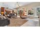 Spacious living room featuring tile flooring, lake views, and an open floor plan at 15810 Stanton Ln, Tampa, FL 33647