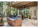 Outdoor kitchen with brick surround, built-in grill, sink and counter space for outdoor entertaining at 15810 Stanton Ln, Tampa, FL 33647