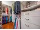Walk-in closet with custom shelving and ample hanging space at 15810 Stanton Ln, Tampa, FL 33647