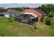 Overhead view of the backyard featuring a screened-in lanai and lush green lawn, great for outdoor living at 1626 Brooksbend Dr, Wesley Chapel, FL 33543
