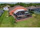 Aerial view of the home's backyard with a screened lanai, offering a private outdoor living space at 1626 Brooksbend Dr, Wesley Chapel, FL 33543