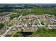 Aerial view of a residential neighborhood featuring homes surrounding several small ponds at 1626 Brooksbend Dr, Wesley Chapel, FL 33543
