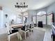 Spacious dining room with large windows and a decorative chandelier at 1626 Brooksbend Dr, Wesley Chapel, FL 33543
