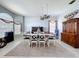 Bright dining room showcasing a large table, elegant chandelier, and decorative accents at 1626 Brooksbend Dr, Wesley Chapel, FL 33543