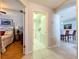 Hallway with access to bedroom, laundry room, and kitchen area at 1626 Brooksbend Dr, Wesley Chapel, FL 33543