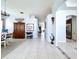 Spacious hallway with tile flooring, decorative niches, and a view into the dining area at 1626 Brooksbend Dr, Wesley Chapel, FL 33543