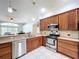 Modern kitchen with stainless steel dishwasher and updated appliances and cabinets at 1626 Brooksbend Dr, Wesley Chapel, FL 33543