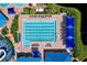 An overhead view captures the community's expansive pool area, featuring lap lanes and sun-shading cabanas at 1626 Brooksbend Dr, Wesley Chapel, FL 33543