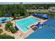 Aerial view of the community pool with lap lanes, leisure pool, and plenty of chairs for residents to enjoy at 1626 Brooksbend Dr, Wesley Chapel, FL 33543