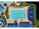 Aerial straight down view of the community lap pool with six lanes, furniture, and ample seating at 1626 Brooksbend Dr, Wesley Chapel, FL 33543
