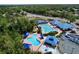 Aerial view of a community pool featuring a lap pool, leisure pool, splash pad, and other amenities at 1626 Brooksbend Dr, Wesley Chapel, FL 33543