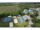 Aerial view of community sports courts featuring tennis courts, pickleball courts, and a volleyball court at 1626 Brooksbend Dr, Wesley Chapel, FL 33543