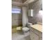 Retro bathroom featuring floral wallpaper, yellow bath tub, and white vanity at 1679 S Lake Ave # 4, Clearwater, FL 33756