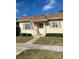 Charming single-story home featuring a cozy front porch, shutters, and manicured landscaping at 1679 S Lake Ave # 4, Clearwater, FL 33756