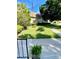 Charming home with manicured lawn, a beautiful palm and mature trees at 1679 S Lake Ave # 4, Clearwater, FL 33756