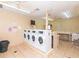 Clean laundry room with multiple washers and dryers at 1679 S Lake Ave # 4, Clearwater, FL 33756