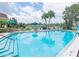 Refreshing pool area with lounge chairs and umbrella, perfect for relaxation at 1679 S Lake Ave # 4, Clearwater, FL 33756