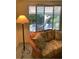 Cozy sitting area with floral wicker sofa and views of the backyard at 1679 S Lake Ave # 4, Clearwater, FL 33756