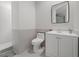 Bathroom featuring white vanity, modern toilet, and tiled shower at 17062 Comunidad De Avila, Lutz, FL 33548