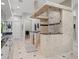 A spacious bathroom with a unique shower enclosure, granite countertops, and modern fixtures at 17062 Comunidad De Avila, Lutz, FL 33548