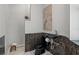 Modern powder room with black fixtures, and elegant wall features at 17062 Comunidad De Avila, Lutz, FL 33548