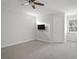 Large bedroom with neutral carpet, ceiling fan and a window with blinds at 17062 Comunidad De Avila, Lutz, FL 33548
