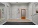 Bright and airy home gym with wood flooring, mirrors and multiple doors at 17062 Comunidad De Avila, Lutz, FL 33548