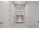 Hallway with marble floors, white walls and arched ceiling at 17062 Comunidad De Avila, Lutz, FL 33548