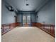 Spacious recreation room with carpet floors, wood trim and a projector at 17062 Comunidad De Avila, Lutz, FL 33548