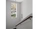 Staircase featuring a hanging lantern fixture and a large window at 17062 Comunidad De Avila, Lutz, FL 33548