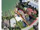 Aerial view of a waterfront property with lush landscaping and private dock at 175 Bath Club N Blvd, North Redington Beach, FL 33708