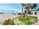 Backyard view with access to a waterfront and a dock, perfect for enjoying outdoor living at 175 Bath Club N Blvd, North Redington Beach, FL 33708