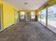 Bright room with large sliding doors, yellow walls, and lots of natural light at 175 Bath Club N Blvd, North Redington Beach, FL 33708