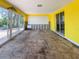 Bright room with large sliding doors, yellow walls, and lots of natural light at 175 Bath Club N Blvd, North Redington Beach, FL 33708
