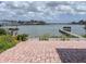 Expansive waterfront view featuring a private dock, perfect for enjoying the serene surroundings at 175 Bath Club N Blvd, North Redington Beach, FL 33708