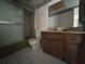 Bathroom with a toilet, shower stall, and wooden vanity with counter space at 1845 S Highland Ave # 6-11, Largo, FL 33756