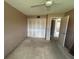 Bedroom featuring a ceiling fan, and a double door closet at 1845 S Highland Ave # 6-11, Largo, FL 33756