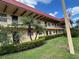 Inviting exterior view of a multi-story building with lush landscaping at 1845 S Highland Ave # 6-11, Largo, FL 33756
