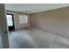 The living room has neutral walls and carpet, awaiting personal updates at 1845 S Highland Ave # 6-11, Largo, FL 33756